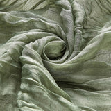 gros plan texture du chemin de table en gaze vert 